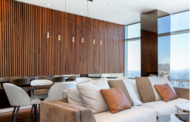 Master bedroom with bronze mirror and wood slats